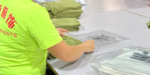 Factory staff packing finished apparel products