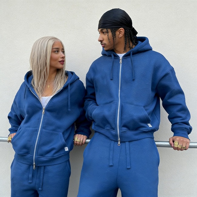 front of unisex jogging suits model, with men and women looking at each other