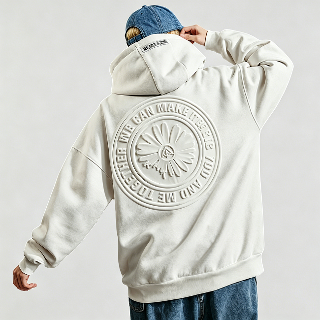Embossed hoodie for men, close view of 3D embossed circular logo on the back