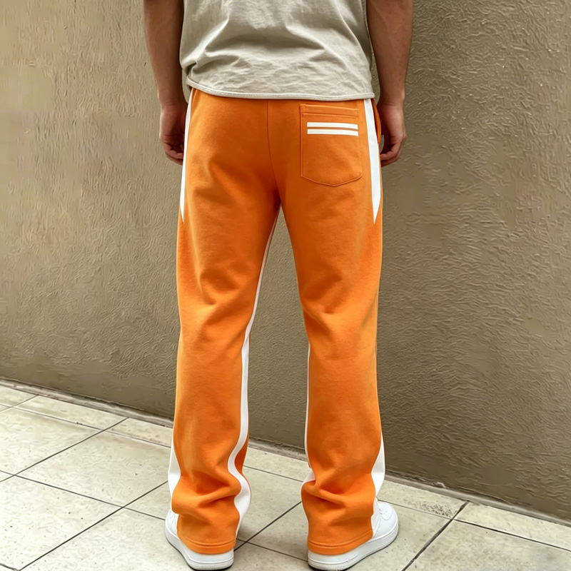 back view of men's orange streetwear sweatpants with white stripes and back pocket, casual athletic pants