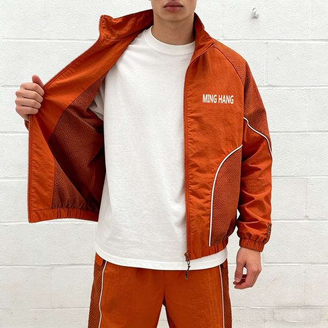 He opened the zipper of his jacket to show the mesh lining fabric of his orange jacket