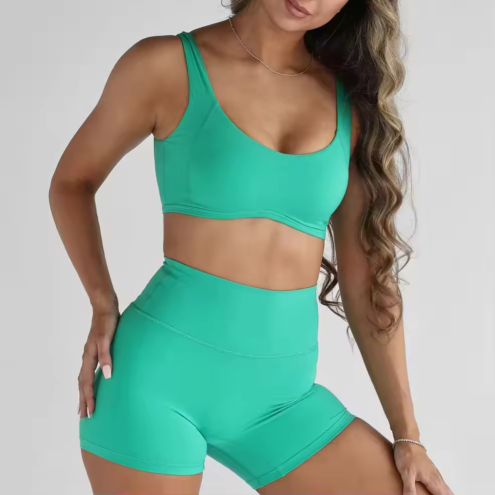 model wearing green yoga shorts set